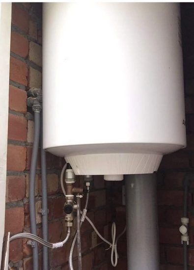 Hardship Grant provides a new boiler and warm water for a young woman in need during winter: